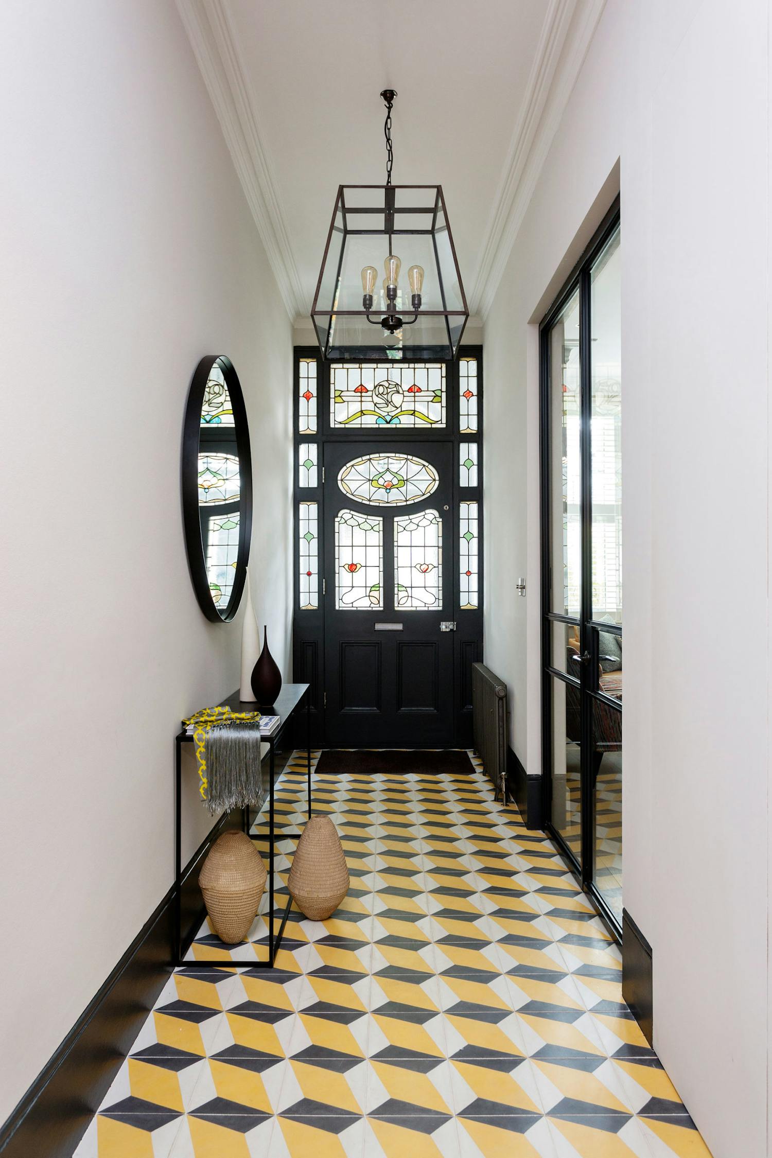 Bright yellow tiled hallway in a Victorian semi-detached house in West London, design and build by Zulufish